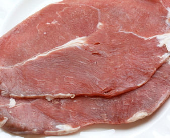 Raw cutlets of veal