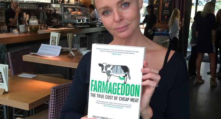 Stella McCartney holds a copy of Farmageddon