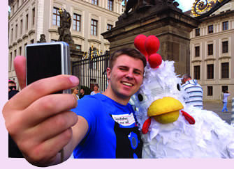 Supporter and Rosa (volunteer in large chicken suit) in Prague