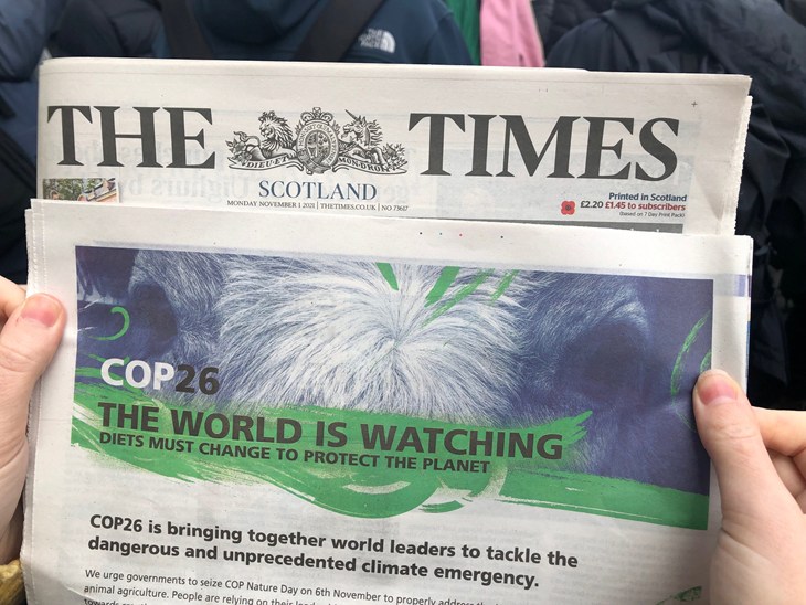CIWF COP26 advert in The Times newspaper be held in hands