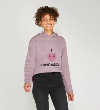 A model wearing one of our Compassion branded hoodies