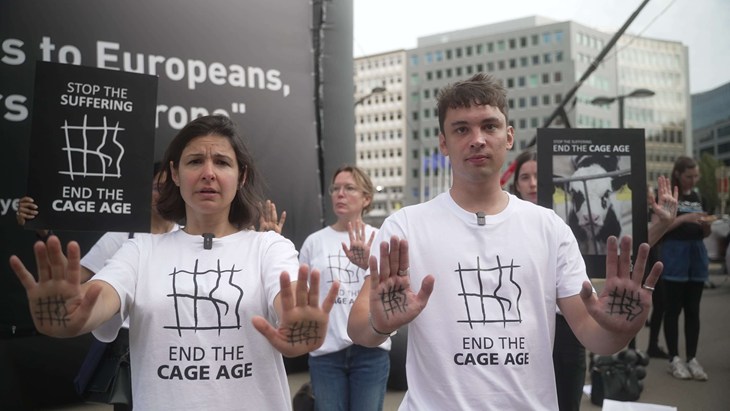 Two people at End the Cage Age protest in Brussels.